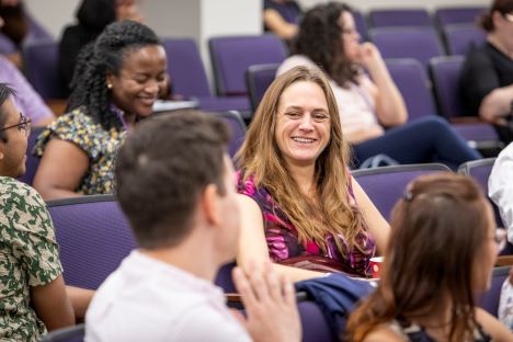 faculty member smiling at New Faculty Summit