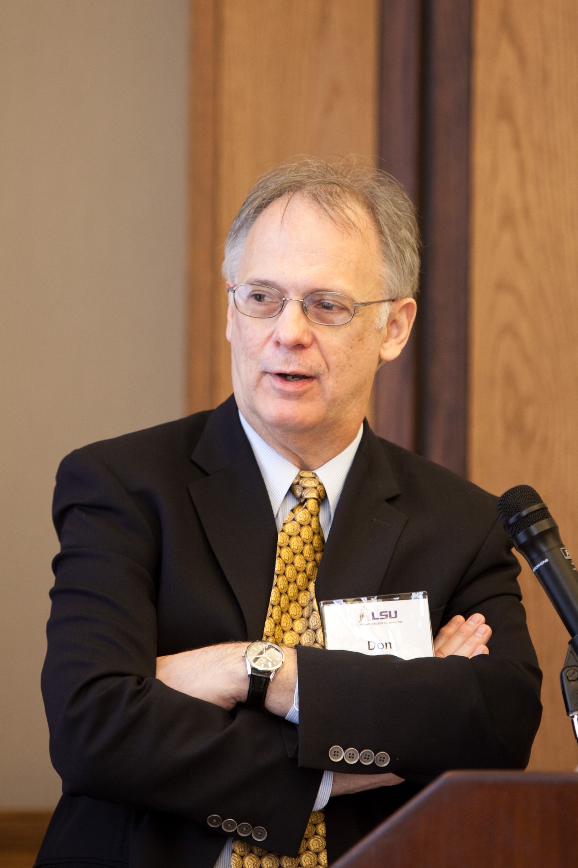 Don Chance speaks at podium during lecture