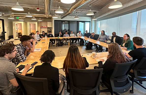 LSU students gathered at a table for a panel discussion.