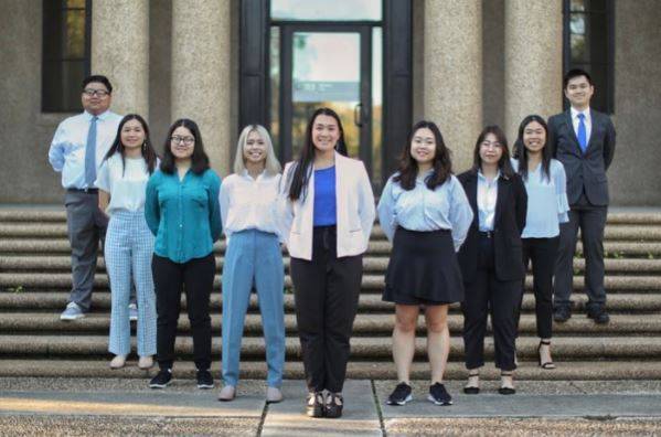 Photo of the SASE leadership board members lined up on outdoor stairs