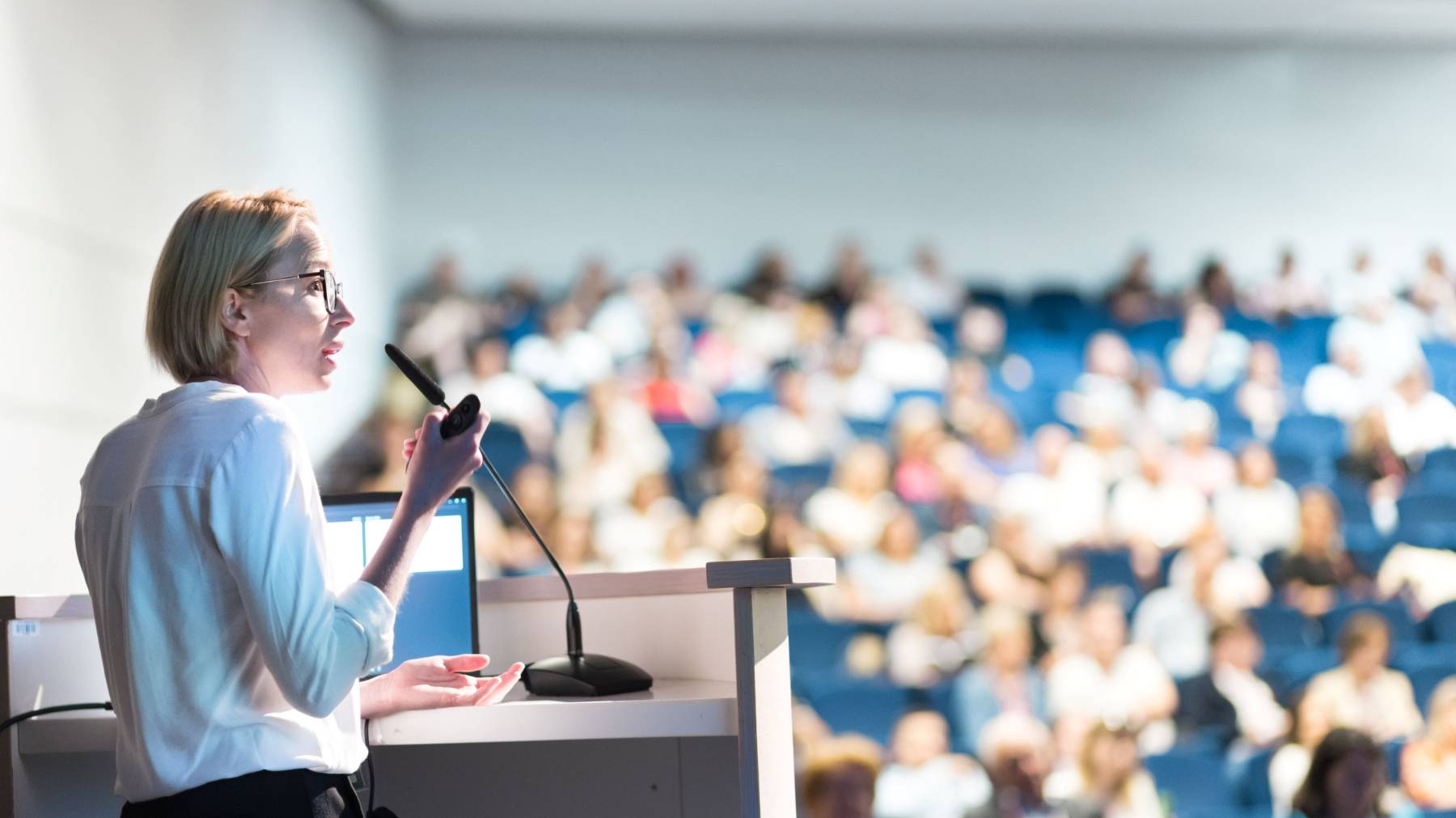 Woman giving a speech to an audience
