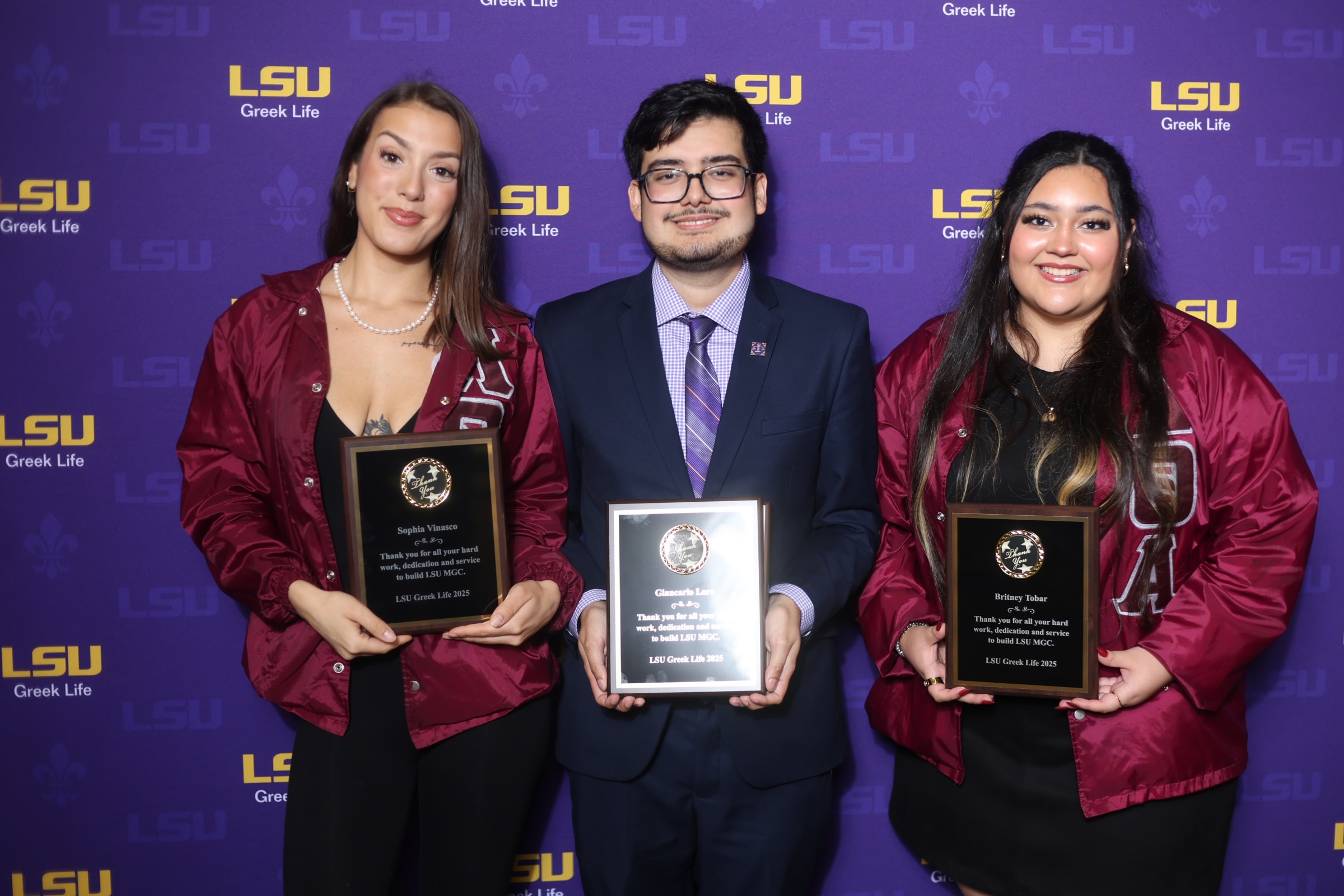 MGC council members pose with an award