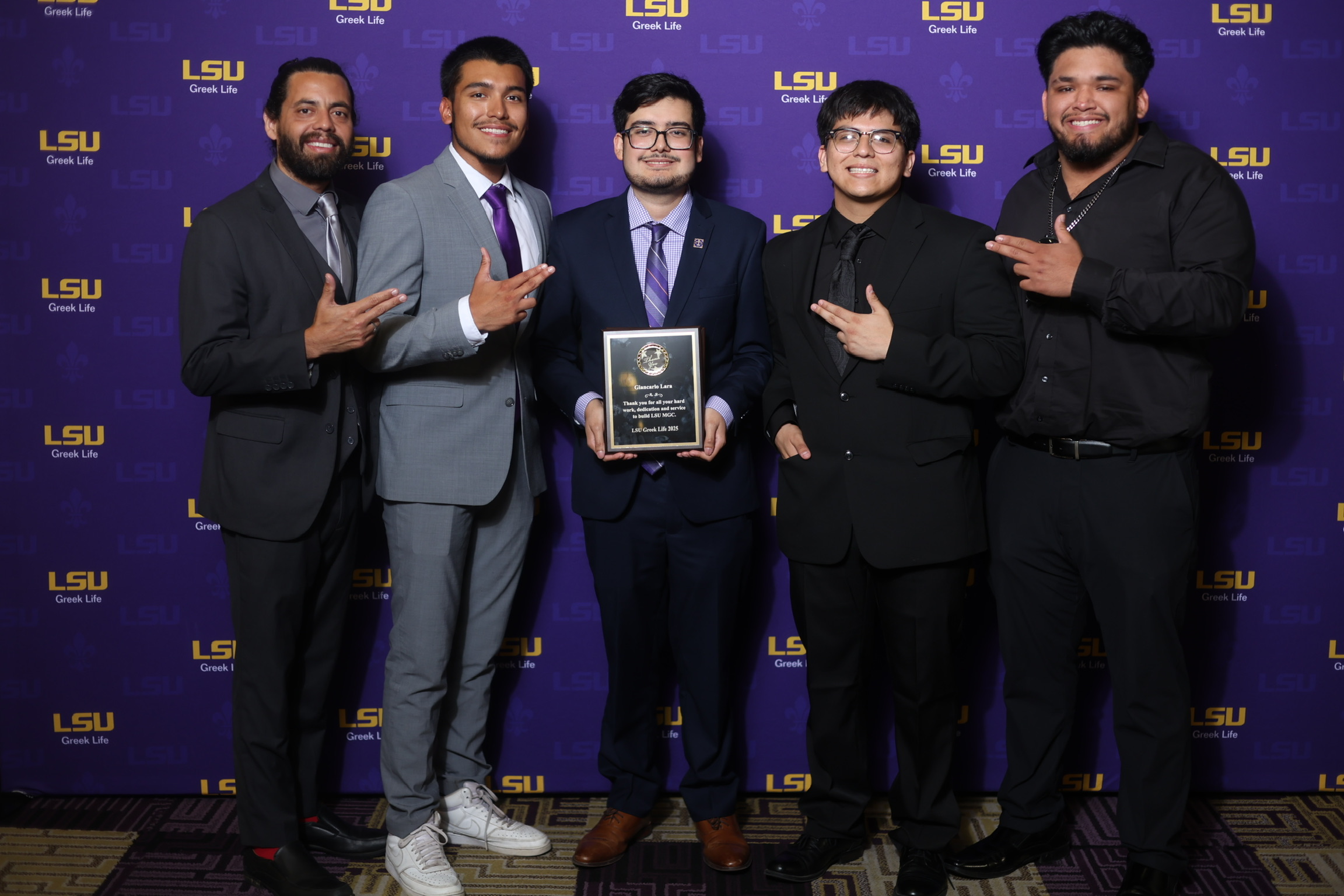 sigma lambda beta pose at an event
