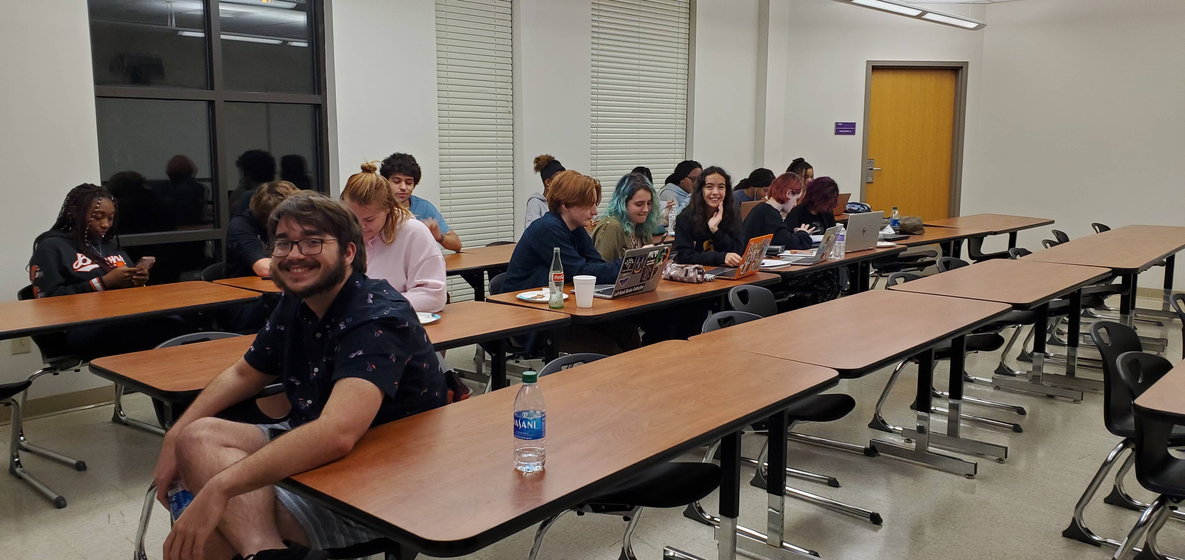 Students sitting at table talking about finals